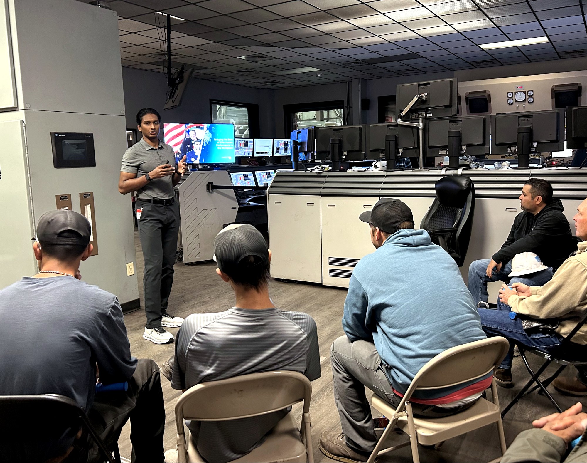 Nicholas Prasad teaching a workshop to operators in an industrial control room